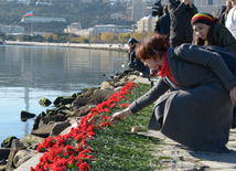 Baku residents bringing flowers to Seaside Boulevard to honor missing oil workers.  Azerbaijan, Dec.07, 2015